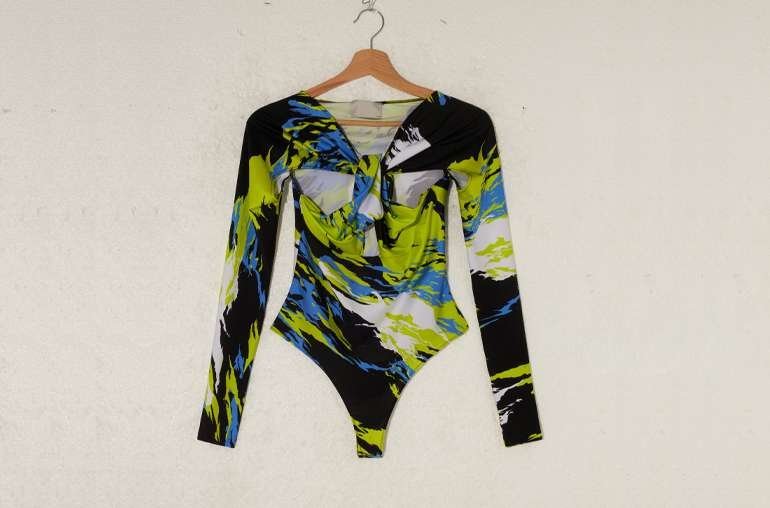 Before: Raw Garment on Plastic Mannequin with Cluttered Studio Background